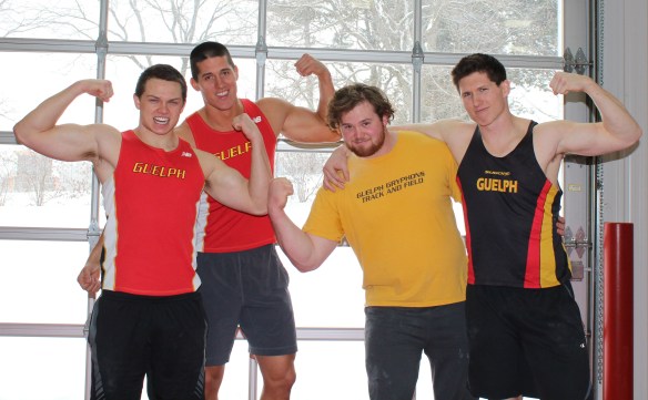 Four of the men's Guelph Gryphons track and field team ham it up for the camera. 