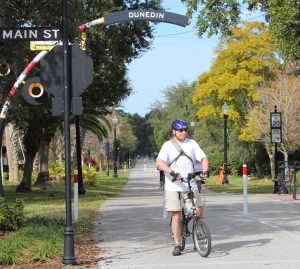 Commuting cyclist on bike path in Dunedin, Florida. This guy actually comes to a complete stop when signs indicate the need to do so. (Andrea Connell)